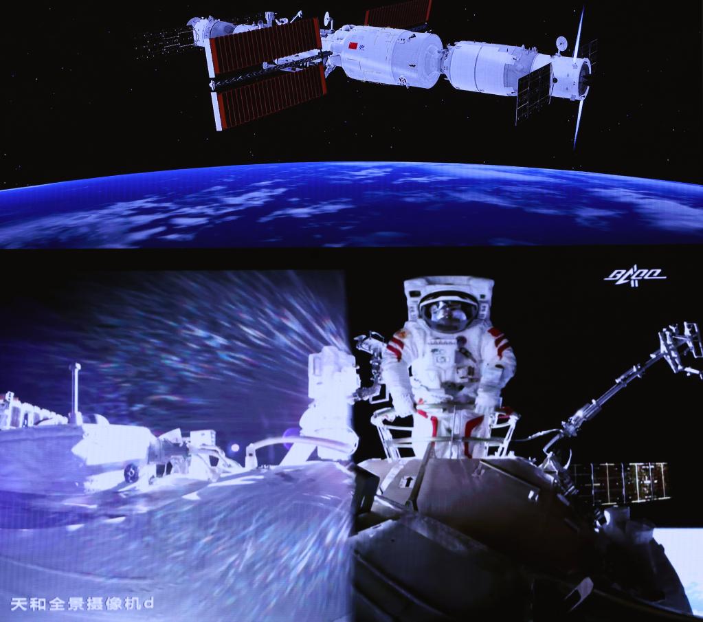 7月4日，在北京航天飛行控制中心大屏拍攝的航天員劉伯明在艙外工作場面。（新華社）