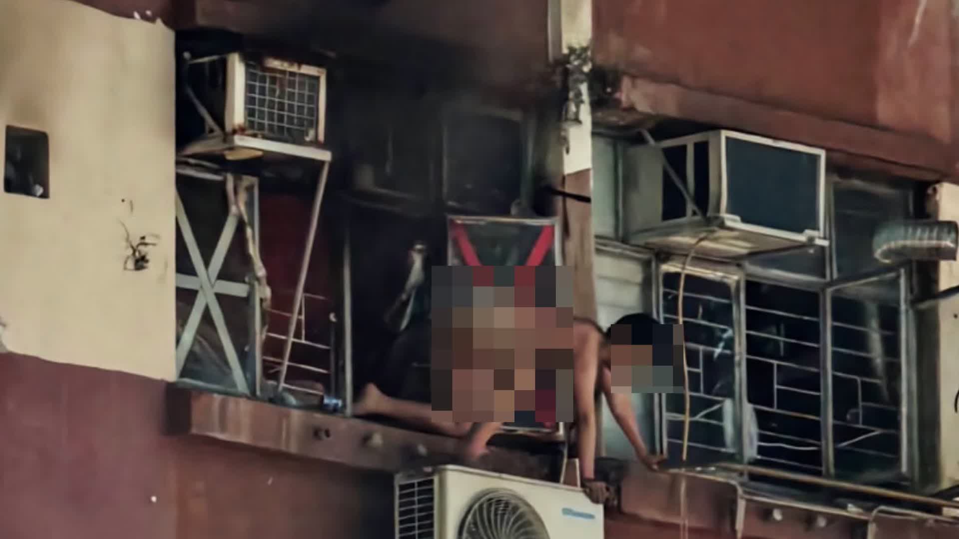 Photo : 香港文匯報 Kwun Tong : un adolescent sauvé d'un incendie sur une climatisation